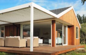Outdoor lounge seating beneath adjustable louvre roof at Tai Tapu alterations project