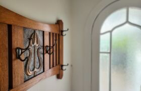 Restored arched timber windows with patterned glass in 1920s bungalow renovation, Christchurch