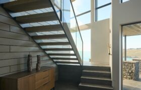 Stair and circulation zone at Scarborough House with natural light and coastal outlook
