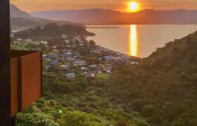 Corten steel balustrades and timber decking overlooking Golden Bay at Tata Beach House